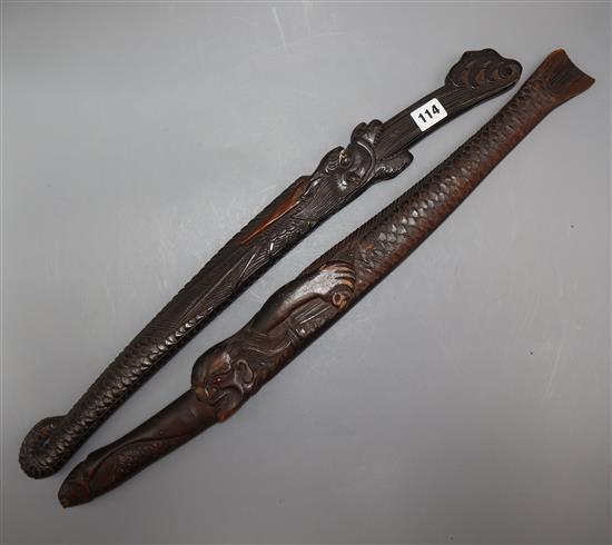 Two 19th century Japanese swords the wood scabbards, carved as a dragon and a merman longest 67cm